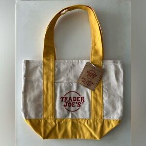 NWT Trader Joe’s Mini White Canvas Tote Yellow Straps Embroidered Red Logo Bag